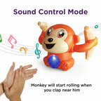 Orange plastic monkey toy holding bananas with sound control and lights