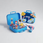 Blue space-themed building block toy set with astronaut and rocket pieces and a toy drill.