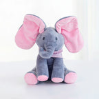 Interactive grey and pink elephant singing plush toy with moving ears